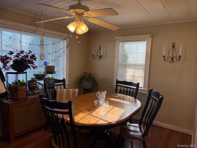 154 Cedar Road East Mastic Beach, NY 11951 - Photo 5 of 9 a view of a dining room with furniture and chandelier