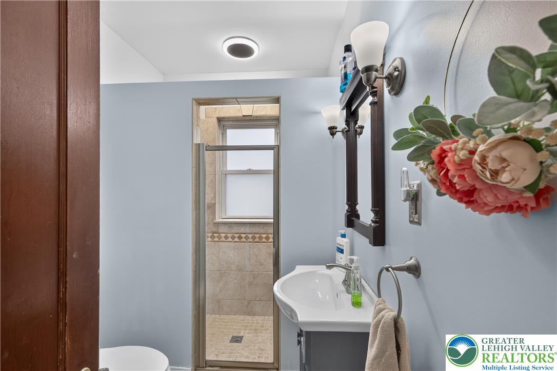 534 Ridge Street Emmaus, PA 18049 - Photo 29 of 40 a bathroom with a sink and a mirror