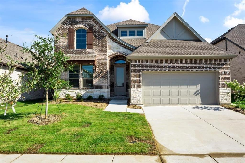 533 Hummingbird Drive Celina, TX 75009 - Photo 1 of 1 a front view of a house with a yard
