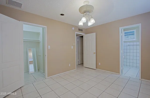 a view of a hallway with chandelier