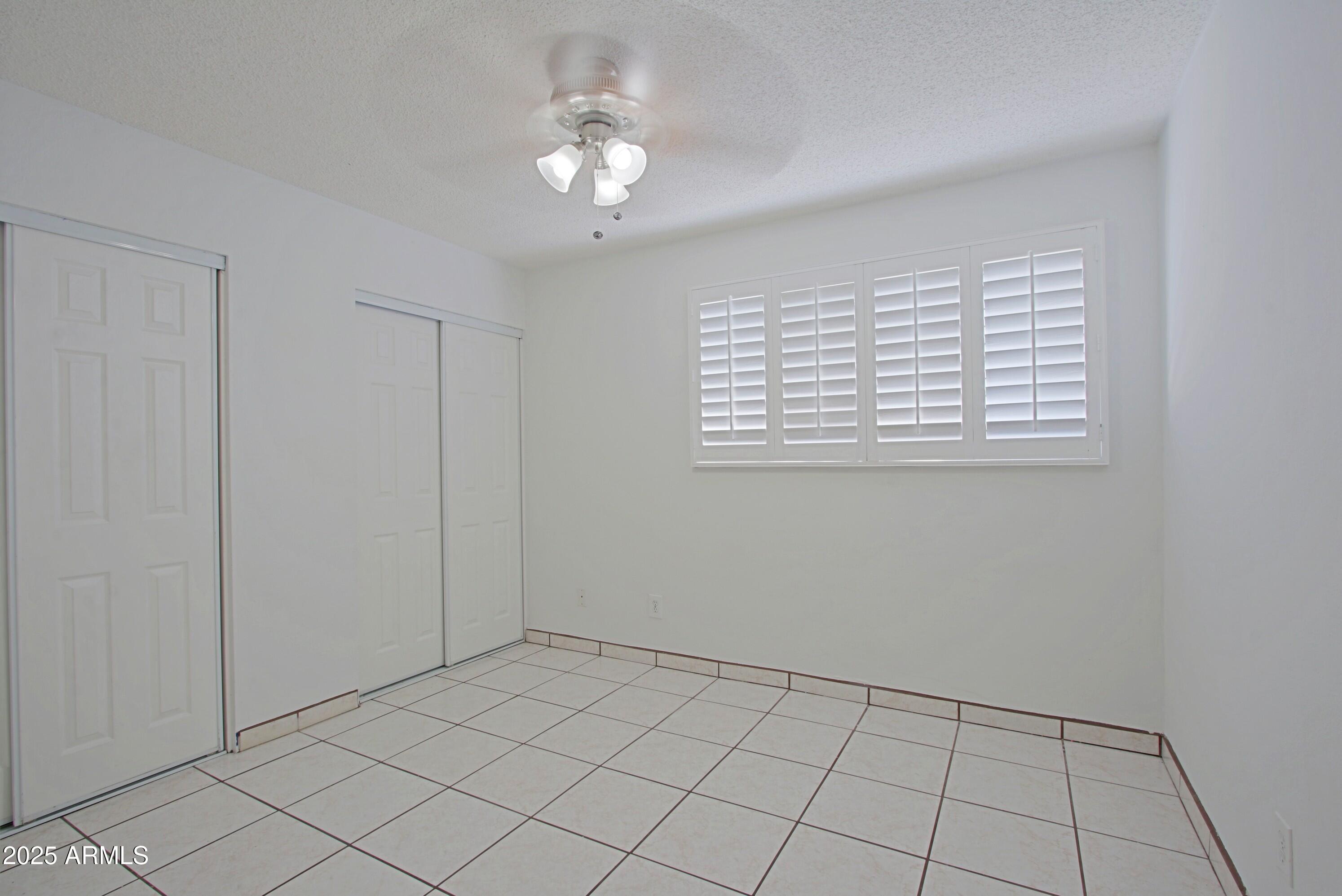 4526 West Altadena Avenue Glendale, AZ 85304 - Photo 20 of 38 a view of an empty room with a window