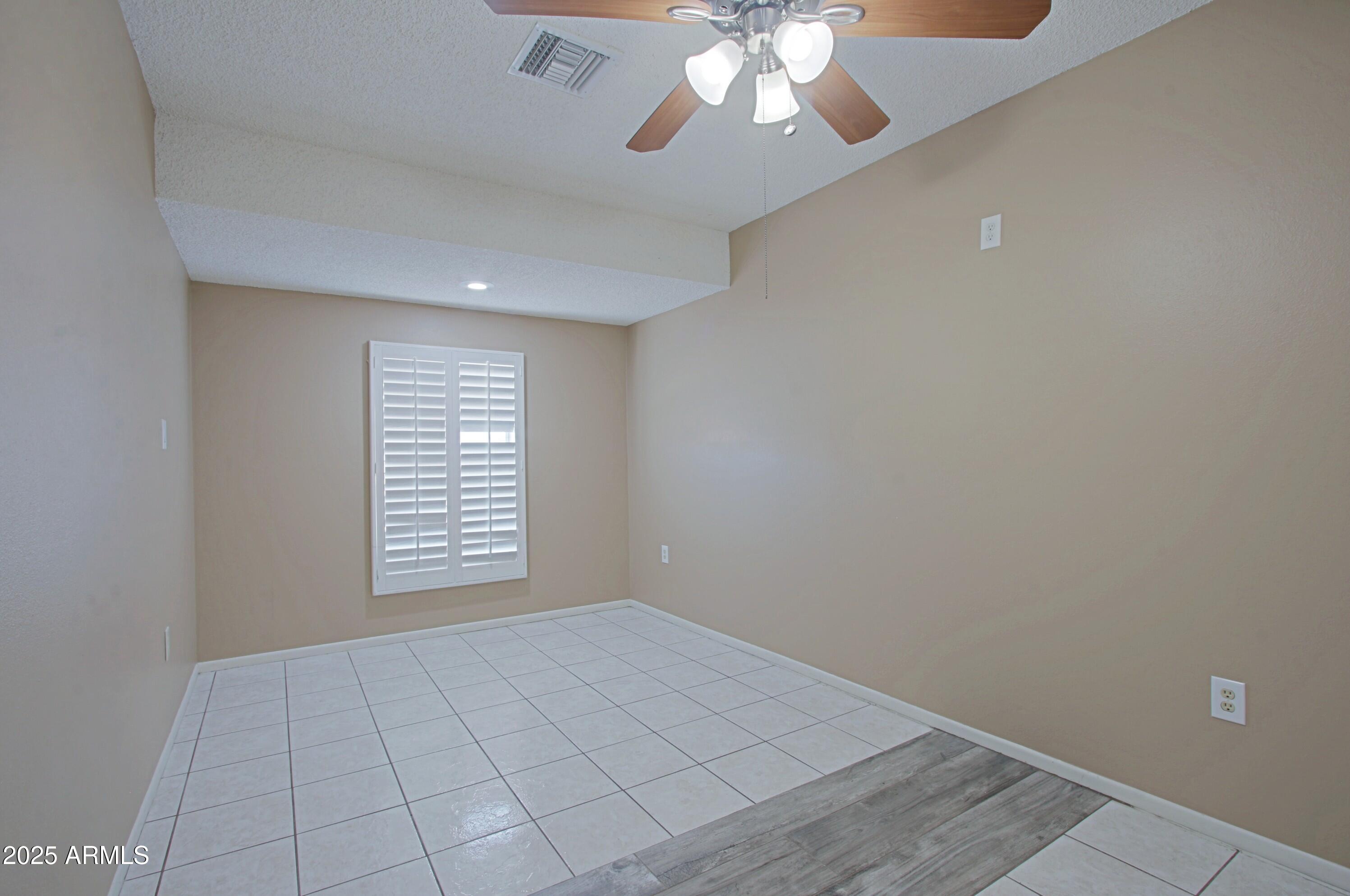4526 West Altadena Avenue Glendale, AZ 85304 - Photo 24 of 38 wooden floor in an empty room with a window