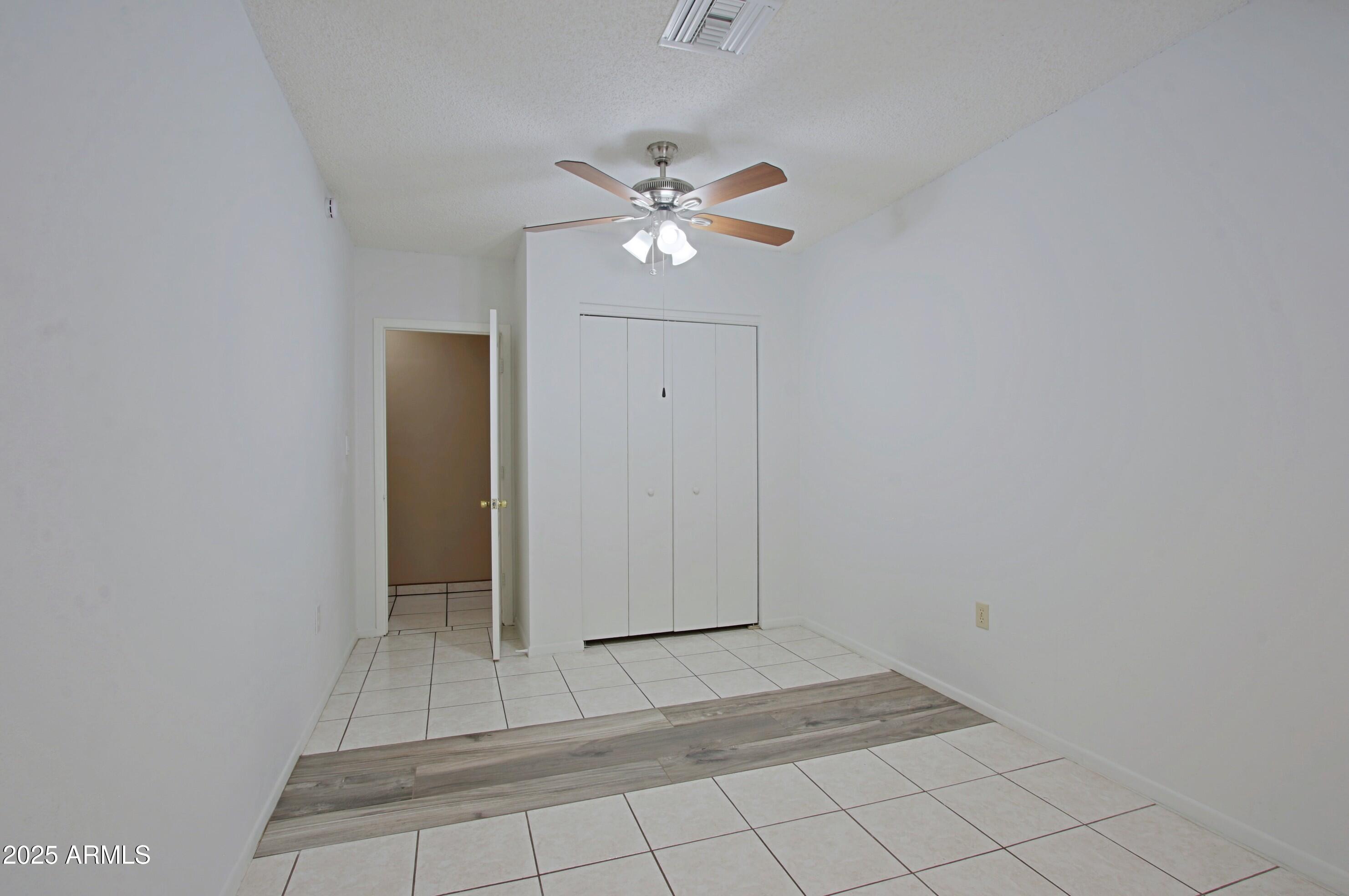 4526 West Altadena Avenue Glendale, AZ 85304 - Photo 27 of 38 a view of empty room with wooden floor