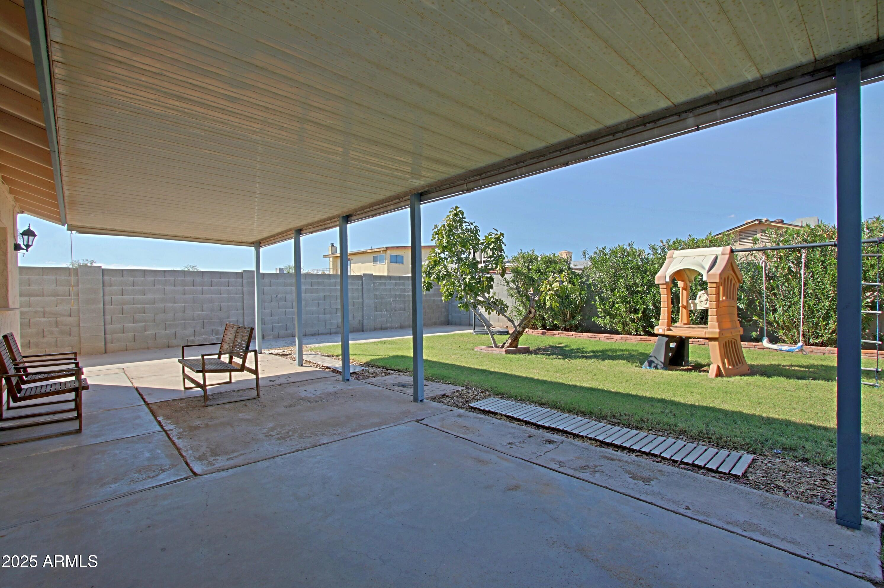 4526 West Altadena Avenue Glendale, AZ 85304 - Photo 31 of 38 a view of a two chair and table in the patio