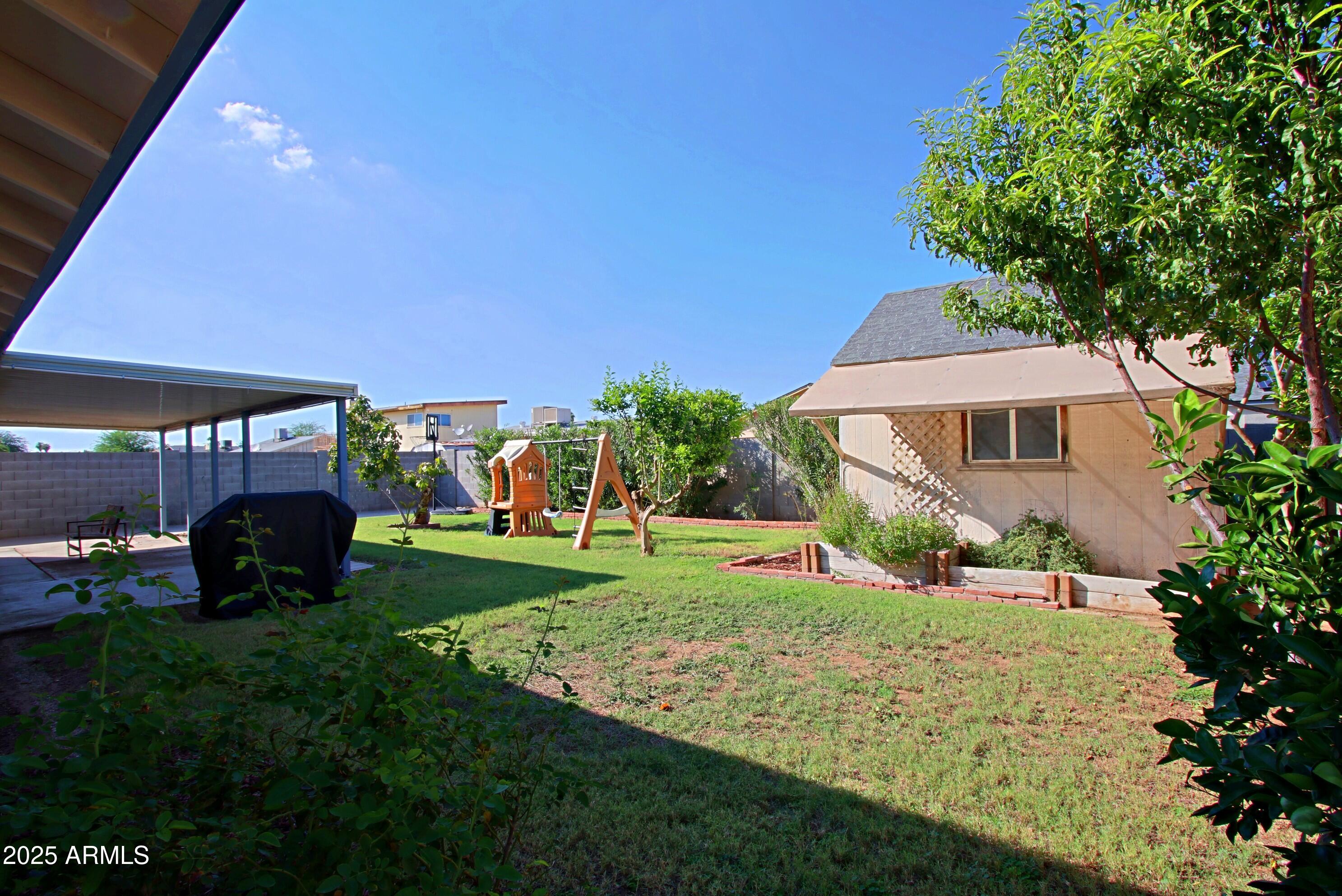4526 West Altadena Avenue Glendale, AZ 85304 - Photo 34 of 38 a view of a house with a yard