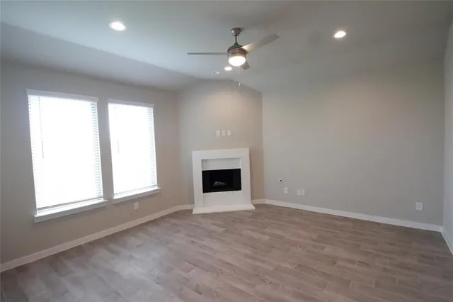 a kitchen with a refrigerator and a stove top oven