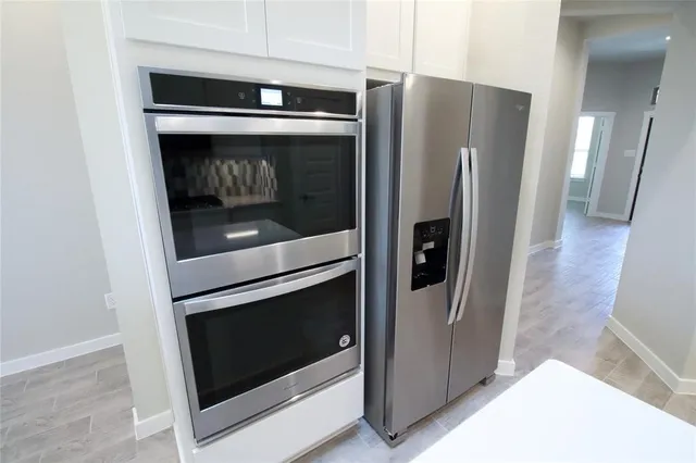 a kitchen with a sink and a refrigerator