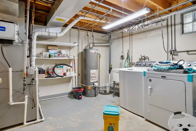 a view of storage and utility room with refrigerator and toys
