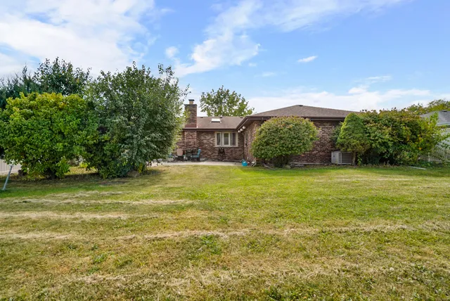 a view of a house with a garden