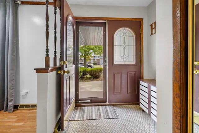 a view of front door with wooden floor