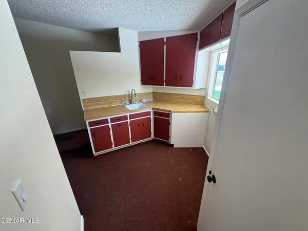 a view of an empty room with a sink