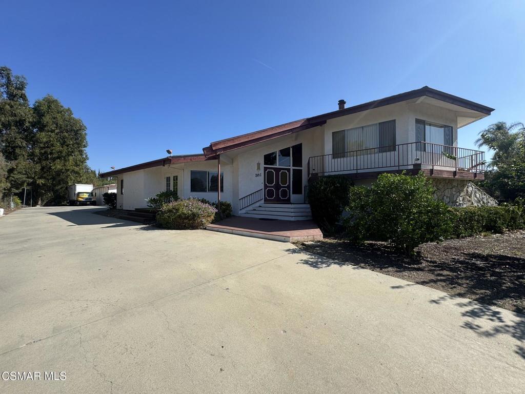 381 Laguna Terrace Simi Valley, CA 93065 - Photo 2 of 48 a front view of a house with a yard