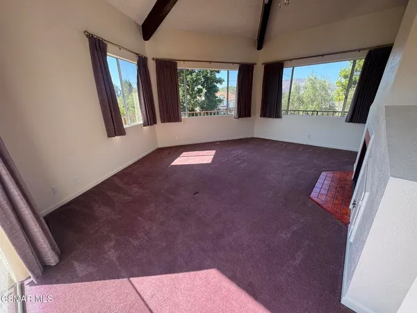 an empty room with windows