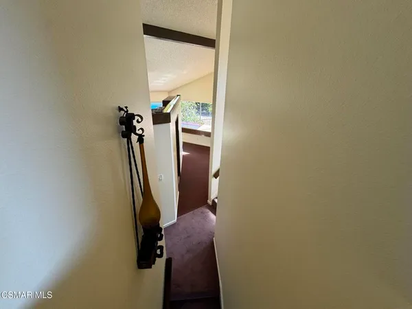 a view of hallway with stairs
