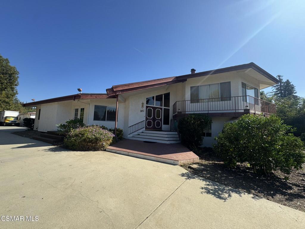 381 Laguna Terrace Simi Valley, CA 93065 - Photo 3 of 48 a front view of a house with a yard