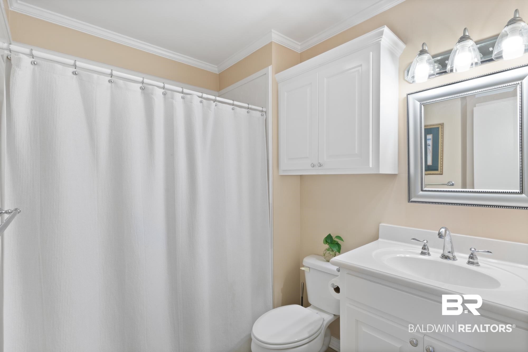 556 Stuart Street Daphne, AL 36526 - Photo 17 of 25 Bathroom with vanity, toilet, and ornamental molding