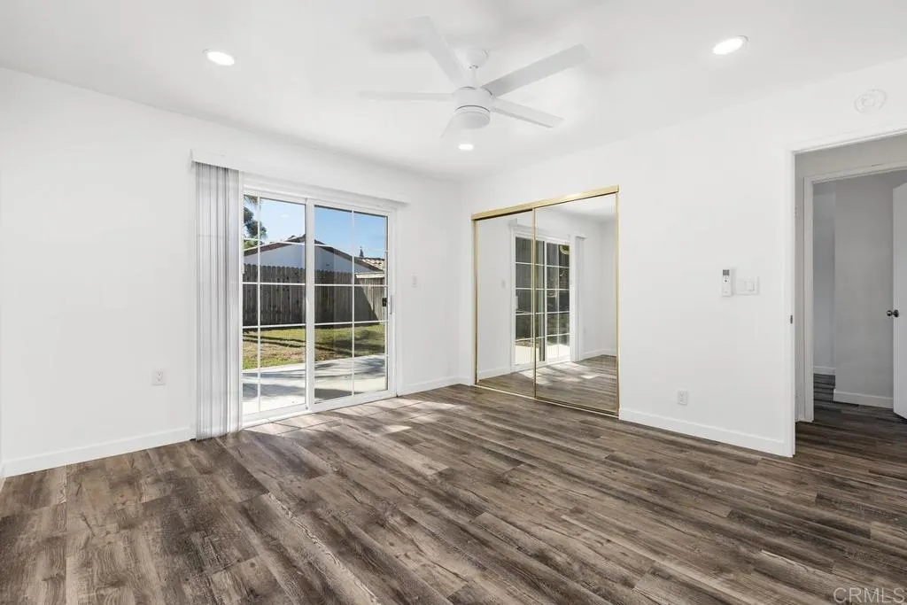 889 Bracero Road Encinitas, CA 92024 - Photo 48 of 59 a view of an empty room with wooden floor and a window