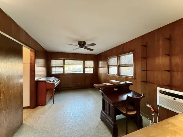 a dining room with furniture and window