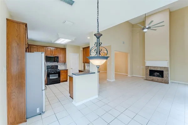 a view of a kitchen with furniture and a fireplace