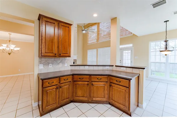 a kitchen with stainless steel appliances granite countertop a sink and cabinets