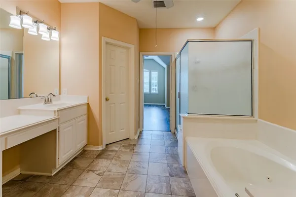 a bathroom with a bathtub and a sink