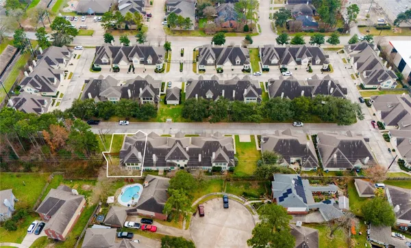 a view of swimming pool with outdoor seating and plants