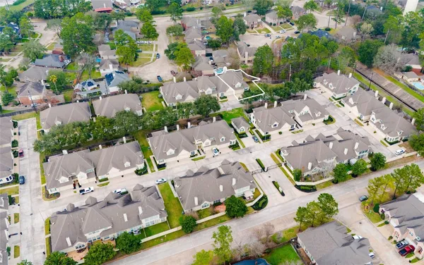 an aerial view of a city with lots of residential buildings