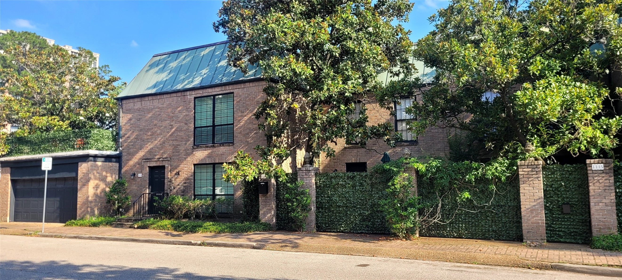 front view of a house with a tree
