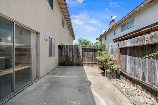 a view of backyard with a patio