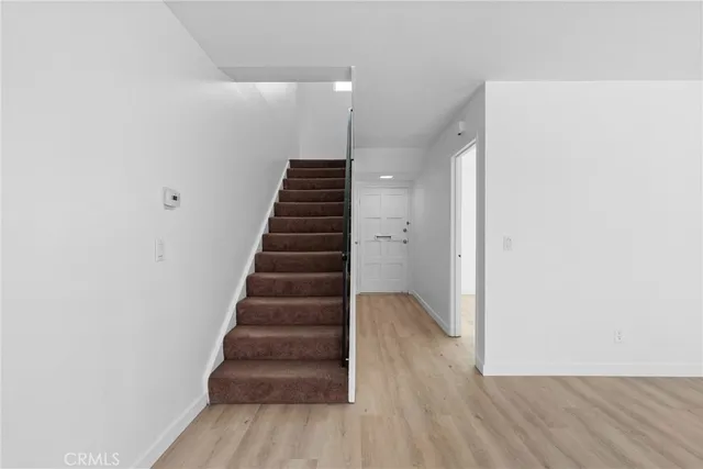 a view of entryway with wooden floor