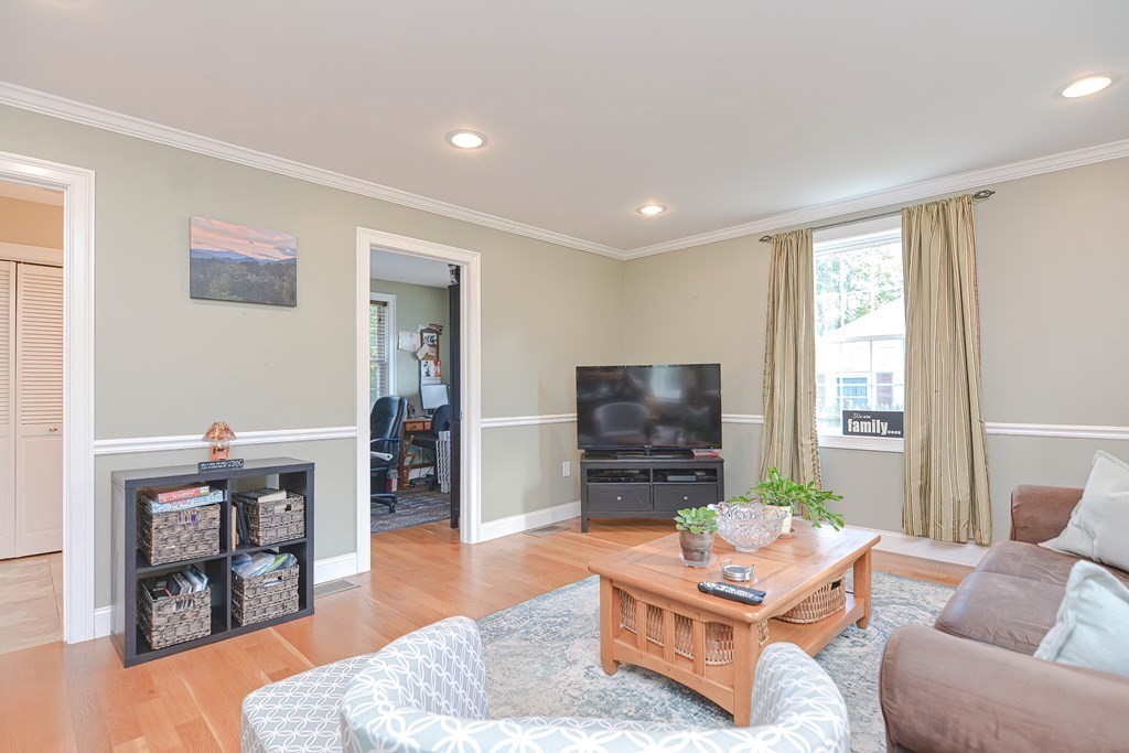 115 Bruce Road Walpole, MA 02081 - Photo 19 of 42 a living room with furniture and a flat screen tv