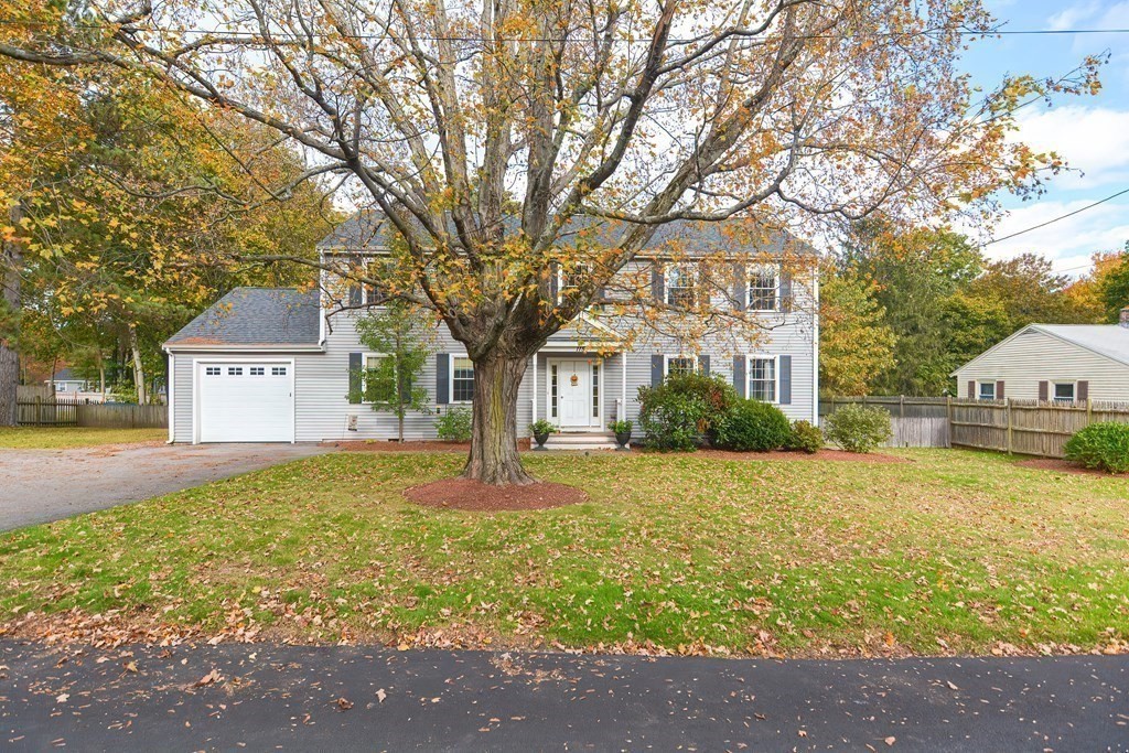 115 Bruce Road Walpole, MA 02081 - Photo 2 of 42 a front view of a house with a yard and trees