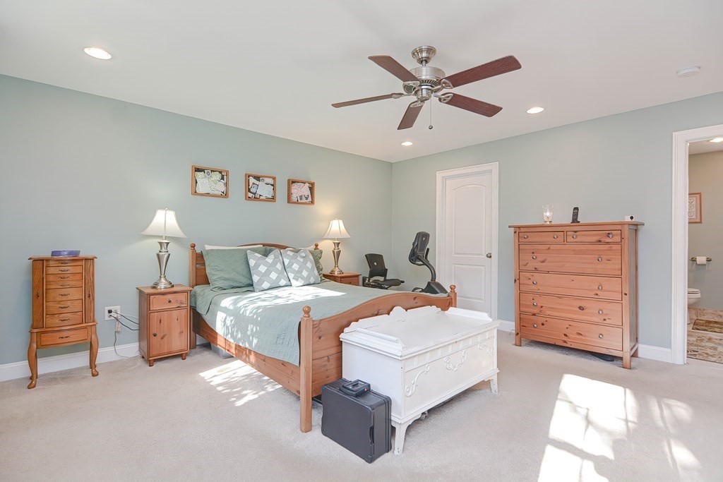 115 Bruce Road Walpole, MA 02081 - Photo 23 of 42 a bedroom with a bed and ceiling fan