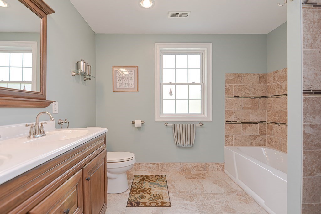 115 Bruce Road Walpole, MA 02081 - Photo 24 of 42 a bathroom with a sink a toilet and bathtub