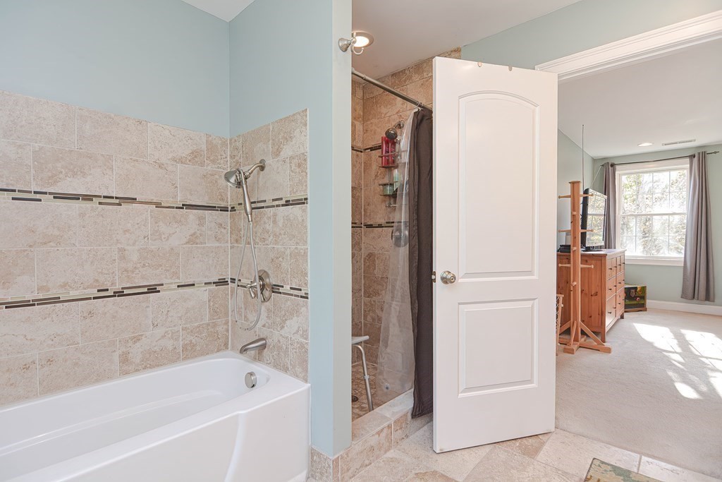 115 Bruce Road Walpole, MA 02081 - Photo 25 of 42 a bathroom with a bathtub and a shower