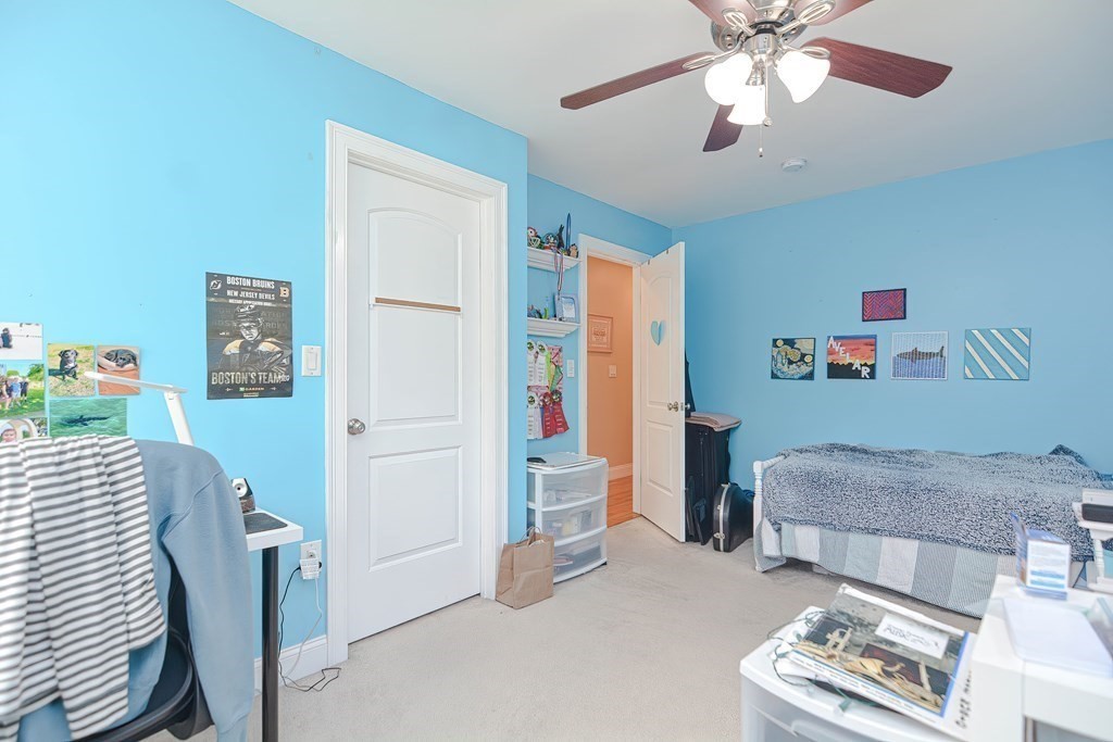 115 Bruce Road Walpole, MA 02081 - Photo 33 of 42 a living room with furniture and a chandelier