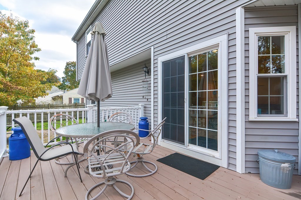 115 Bruce Road Walpole, MA 02081 - Photo 36 of 42 a view of a chair and table on the deck