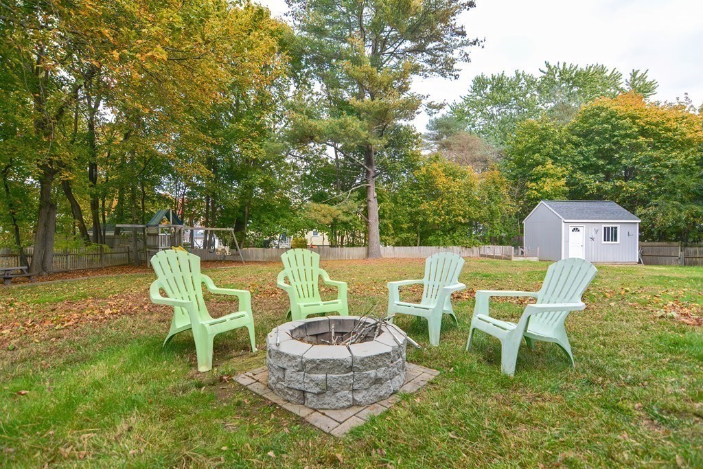 115 Bruce Road Walpole, MA 02081 - Photo 39 of 42 a view of a chairs and table in backyard
