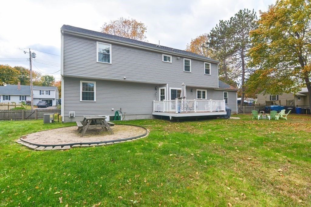 115 Bruce Road Walpole, MA 02081 - Photo 41 of 42 a view of a house with a yard table and chairs