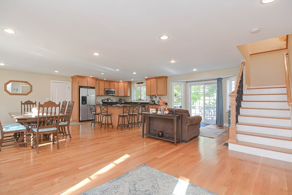 115 Bruce Road Walpole, MA 02081 - Photo 5 of 42 a living room with furniture kitchen view and a wooden floor