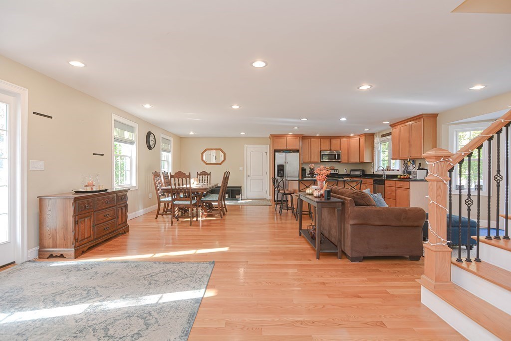 115 Bruce Road Walpole, MA 02081 - Photo 6 of 42 a living room with lots of furniture and kitchen view