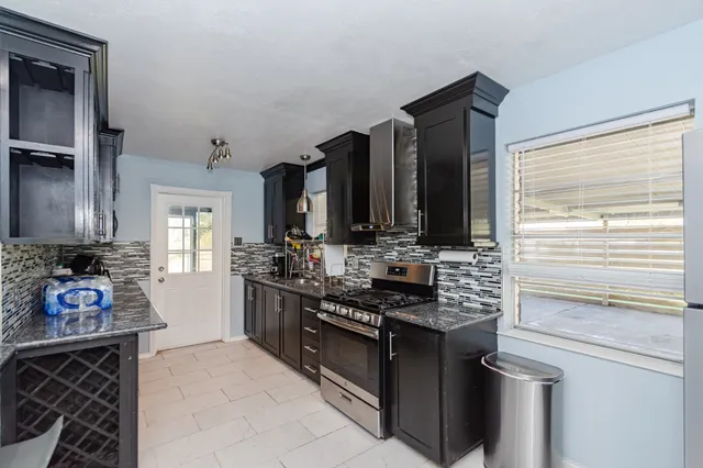 a kitchen with a stove and a sink