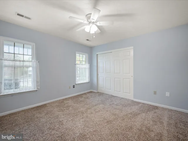 an empty room with fan