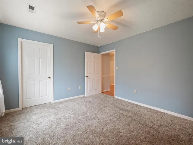 a view of a garage with wooden floor