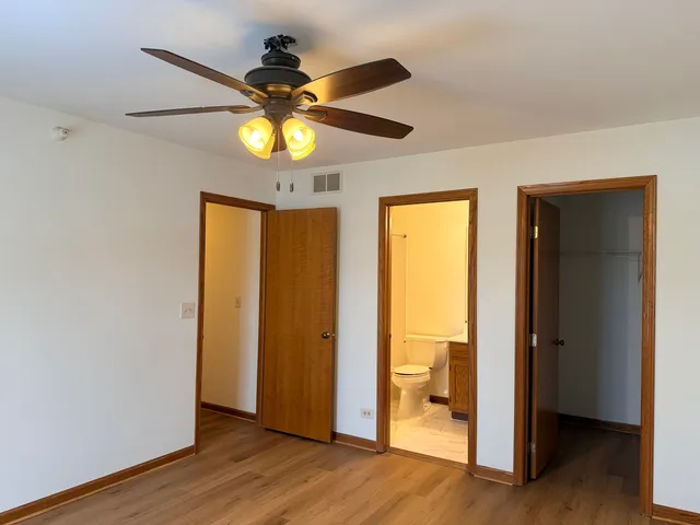 a view of an entryway door with wooden floor