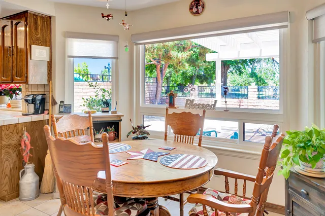 a bathroom with a toilet and a shower curtain