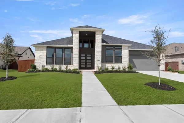 front view of a house with a yard