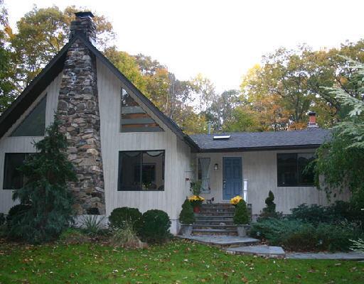 300 Ned's Mountain Road Ridgefield, CT 06877 - Photo 1 of 1 a front view of a house with garden