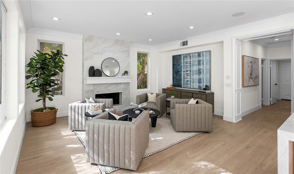 16 Meryton Irvine, CA 92603 - Photo 16 of 54 a living room with furniture and a fireplace