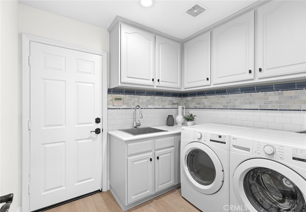 16 Meryton Irvine, CA 92603 - Photo 21 of 54 a view of a storage and utility room with washer and dryer